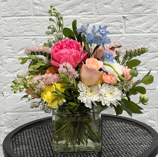 Glass cube with spring blooms